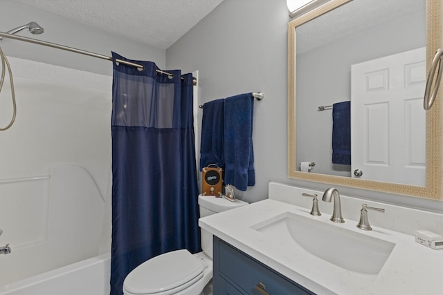 full bathroom with vanity, shower / bath combination with curtain, toilet, and a textured ceiling