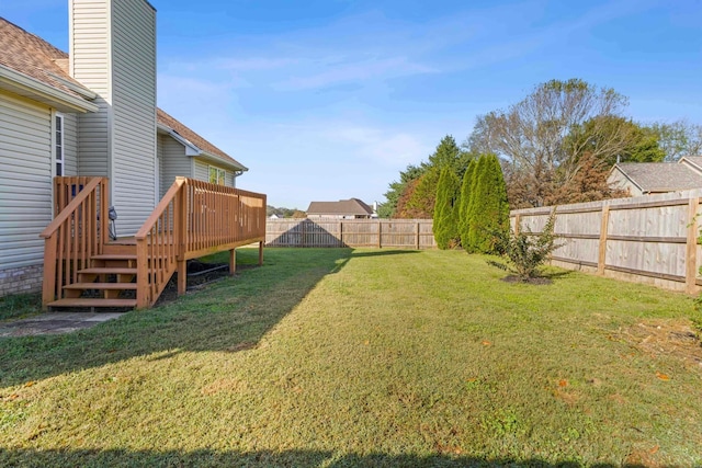 view of yard with a wooden deck