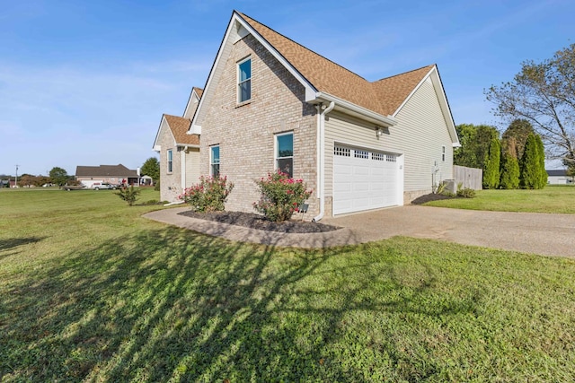 view of front of home featuring a front lawn and a garage