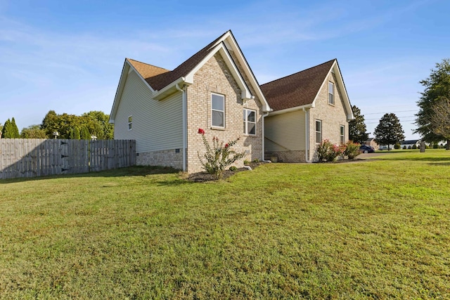 view of home's exterior featuring a lawn