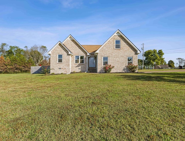 view of front of home with a front lawn