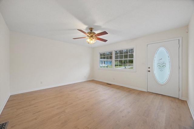 foyer featuring light hardwood / wood-style flooring and ceiling fan