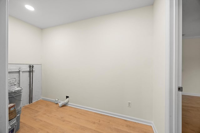 laundry room featuring wood-type flooring