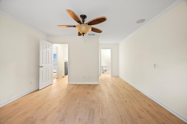 spare room featuring crown molding, light hardwood / wood-style flooring, and ceiling fan