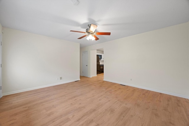 spare room with light hardwood / wood-style flooring