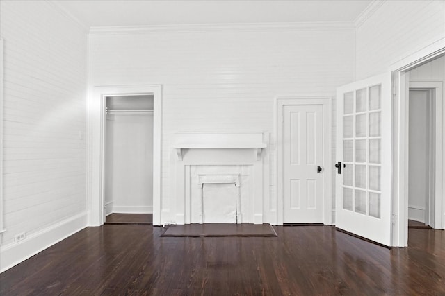 unfurnished bedroom with dark hardwood / wood-style floors and ornamental molding