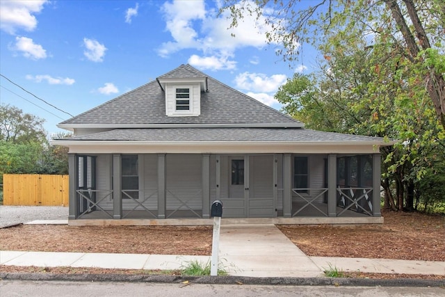 view of front facade featuring a sunroom