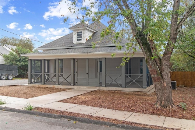 view of front of house featuring a sunroom