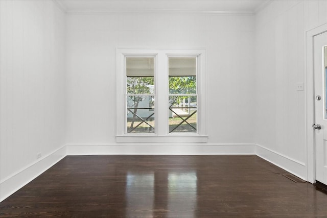 unfurnished room with dark hardwood / wood-style floors and crown molding