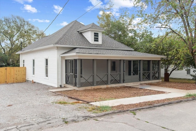 view of front of property with a sunroom