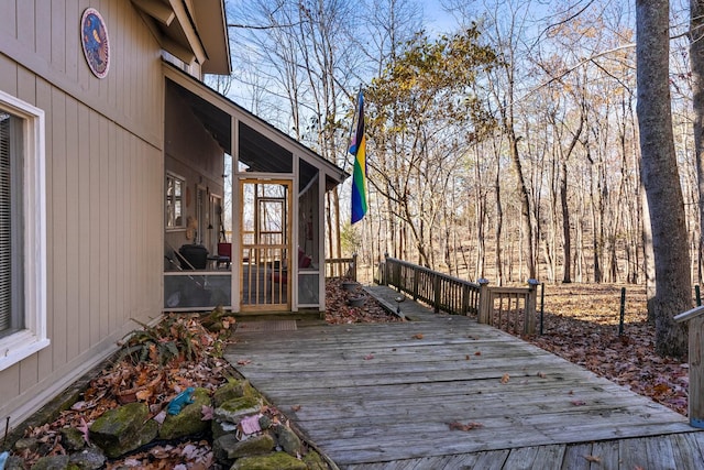 wooden terrace featuring a sunroom