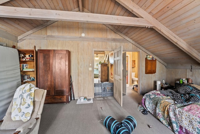 carpeted bedroom with vaulted ceiling with beams, ensuite bath, wood ceiling, and wood walls