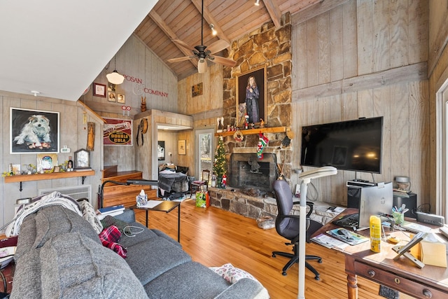 living room featuring wood ceiling, ceiling fan, hardwood / wood-style flooring, high vaulted ceiling, and wood walls