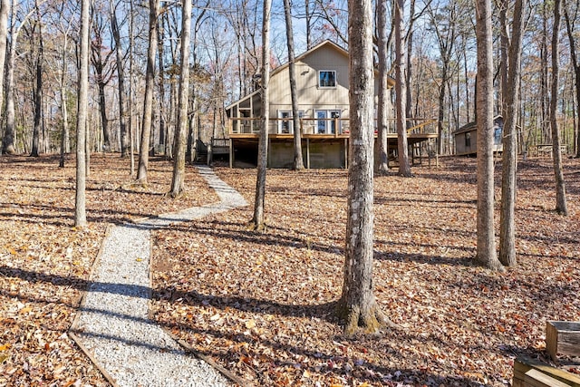 view of yard with a wooden deck