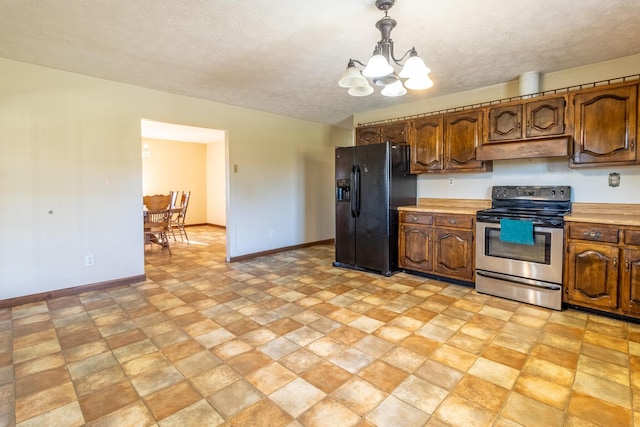 kitchen featuring a chandelier, a textured ceiling, decorative light fixtures, stainless steel range with electric stovetop, and black fridge with ice dispenser