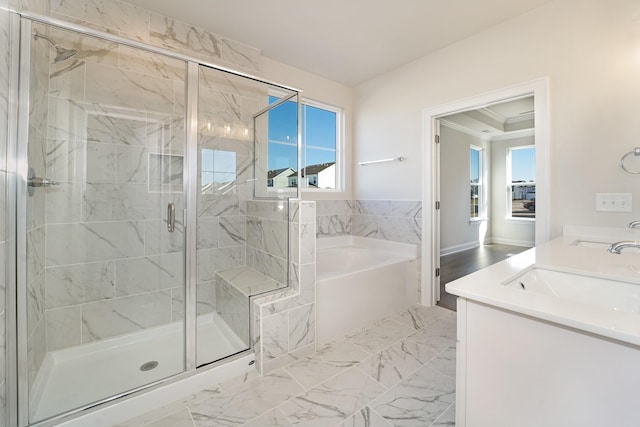 bathroom with vanity, crown molding, and plus walk in shower