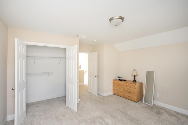 carpeted bedroom featuring a closet