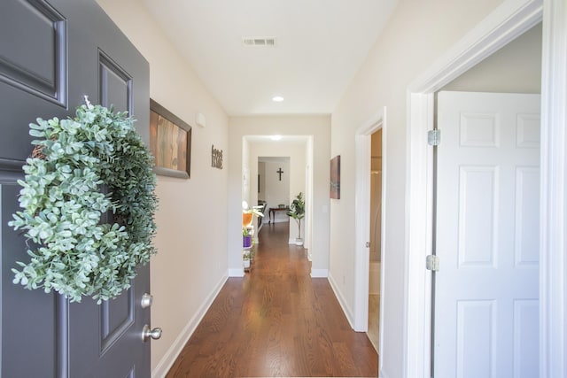 hallway with dark wood-type flooring