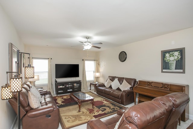 living room with carpet floors, plenty of natural light, and ceiling fan