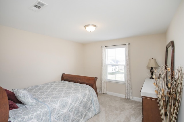 bedroom with light colored carpet