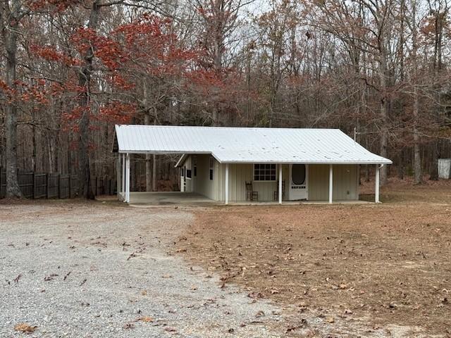 view of outdoor structure with a carport