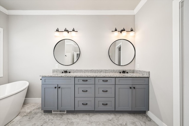 bathroom with a bathtub, crown molding, and vanity