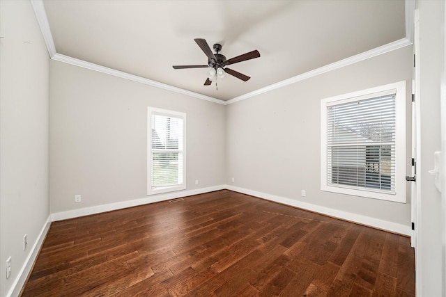 empty room with crown molding, ceiling fan, and dark hardwood / wood-style floors