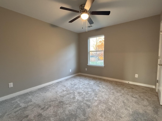 spare room with carpet flooring and ceiling fan