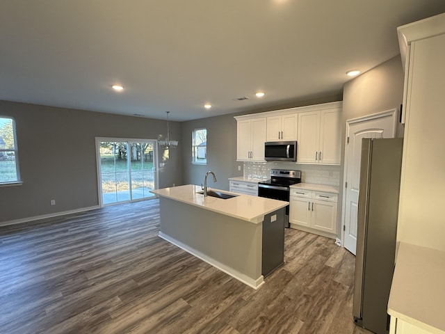 kitchen featuring white cabinets, dark hardwood / wood-style flooring, sink, and stainless steel appliances