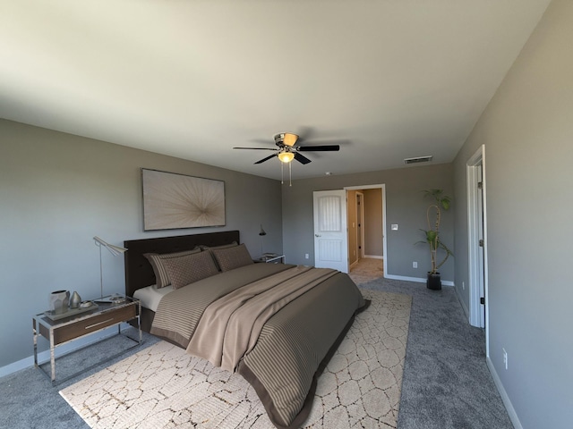 bedroom featuring ceiling fan and light carpet