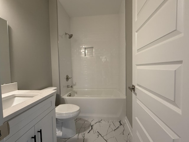 full bathroom with toilet, vanity, and tiled shower / bath