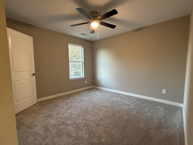 unfurnished room featuring carpet flooring and ceiling fan