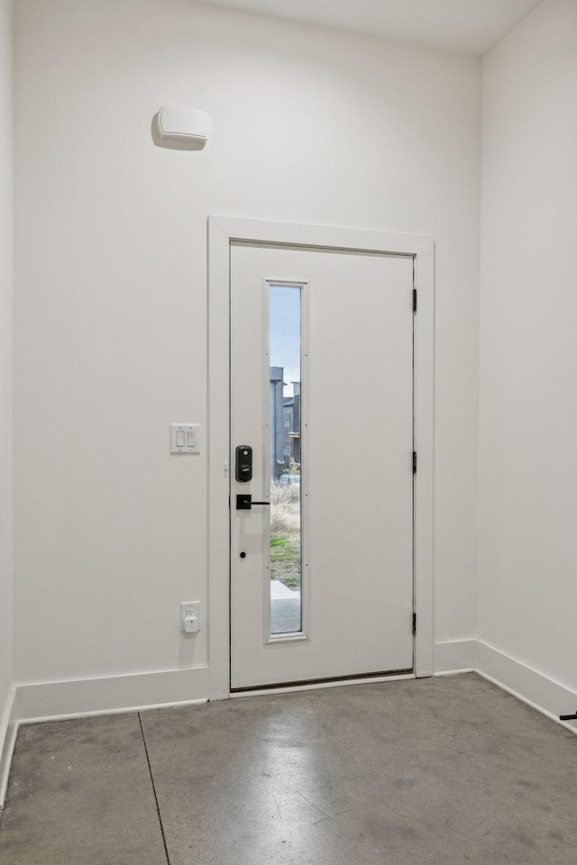 entrance foyer featuring concrete floors