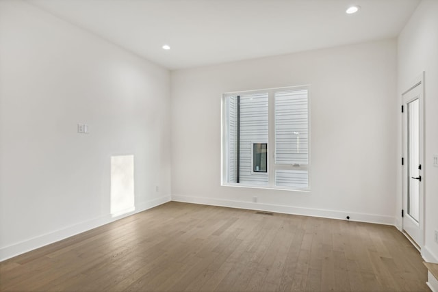 unfurnished room with light hardwood / wood-style flooring