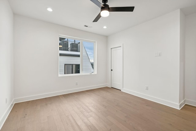 unfurnished room featuring light hardwood / wood-style flooring and ceiling fan