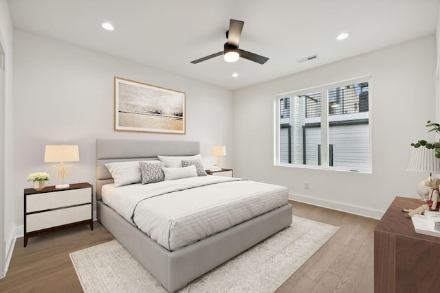 bedroom featuring hardwood / wood-style flooring and ceiling fan