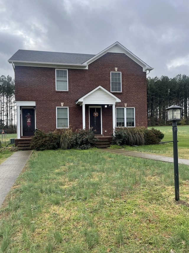 view of front of home with a front yard