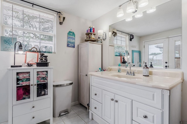 bathroom with tile patterned floors and vanity