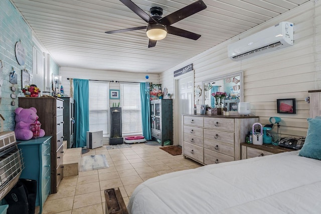 tiled bedroom featuring a wall mounted air conditioner and ceiling fan