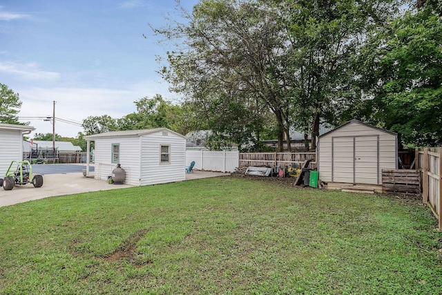 view of yard with a patio and a shed