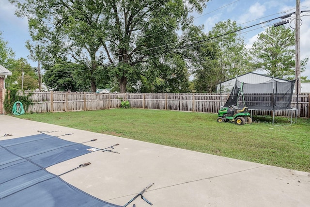 view of yard with a trampoline