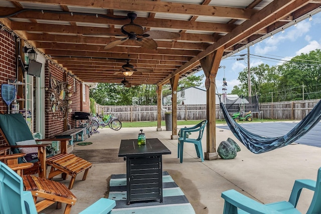 view of patio / terrace with ceiling fan and a trampoline