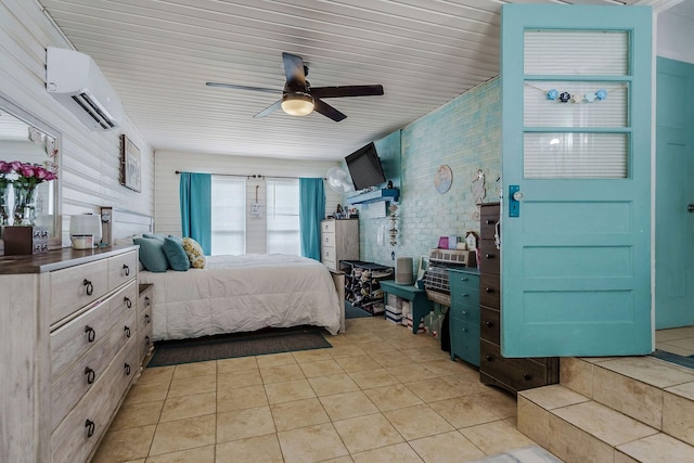 tiled bedroom featuring a wall mounted air conditioner and ceiling fan