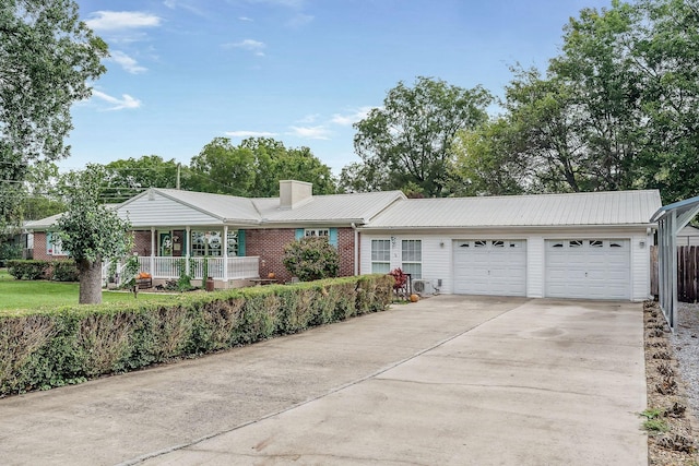 ranch-style house featuring a porch and a garage