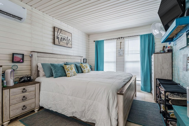 bedroom featuring a wall mounted air conditioner and wood ceiling