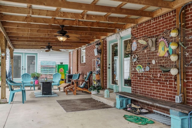 view of patio featuring ceiling fan