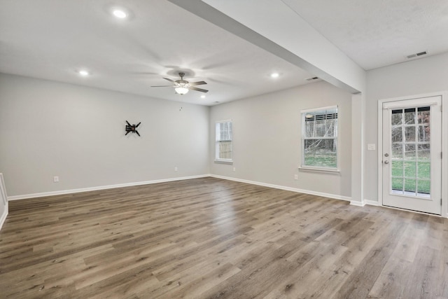 unfurnished room featuring ceiling fan and light hardwood / wood-style floors