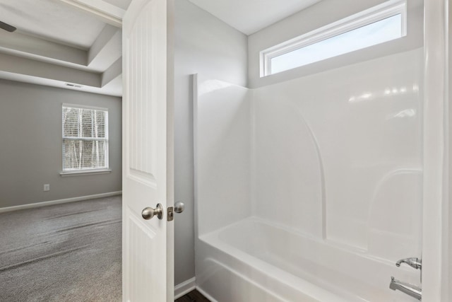 bathroom with shower / tub combination and a healthy amount of sunlight