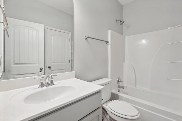 full bathroom with vanity, toilet, and bathtub / shower combination