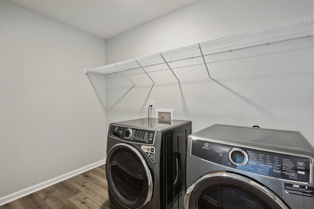 laundry room featuring dark hardwood / wood-style floors and independent washer and dryer